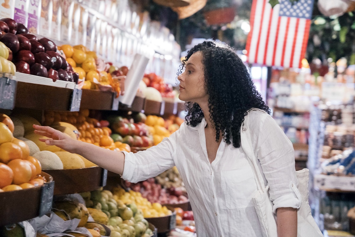 woman inspecting produce